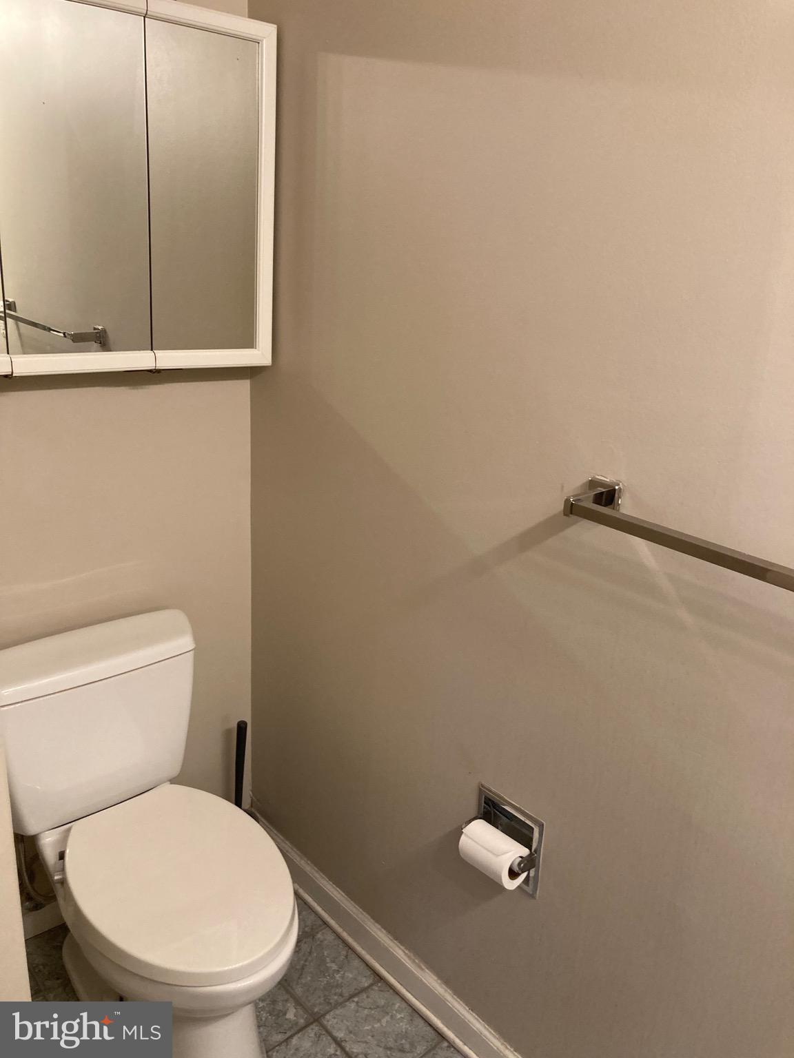 1001-13 Chestnut Street, Unit 705W Philadelphia, PA 19103 - Photo 14 of 30 a white toilet sitting next to a window