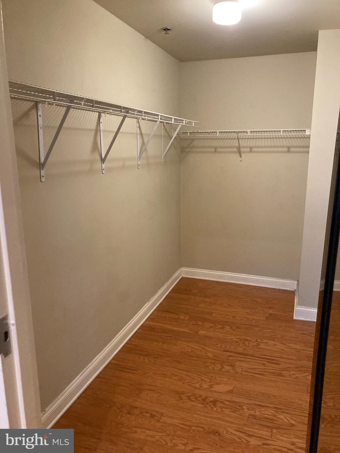 1001-13 Chestnut Street, Unit 705W Philadelphia, PA 19103 - Photo 17 of 30 a view of a room with racks on the wall