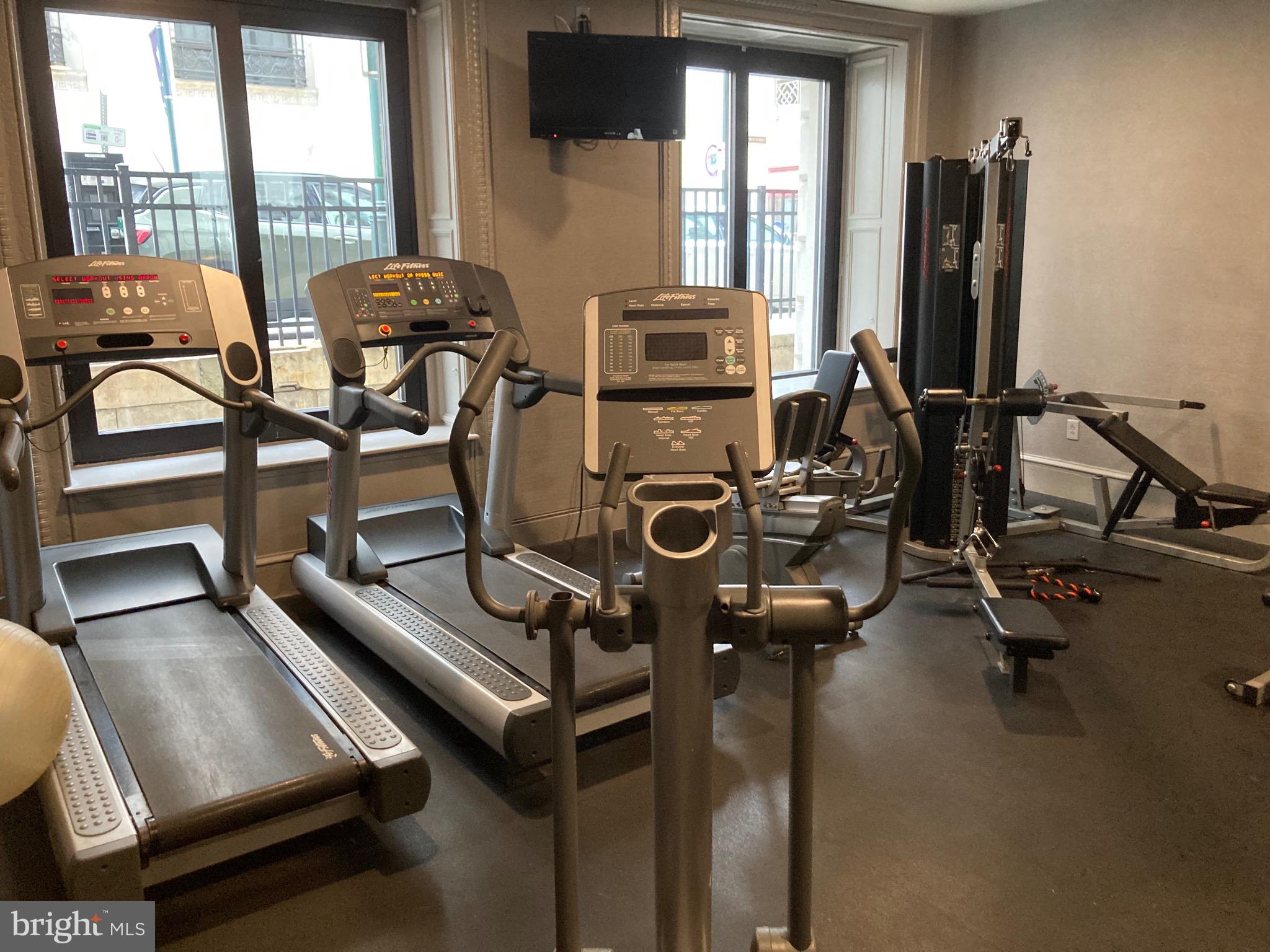 1001-13 Chestnut Street, Unit 705W Philadelphia, PA 19103 - Photo 25 of 30 a view of a room with gym equipment
