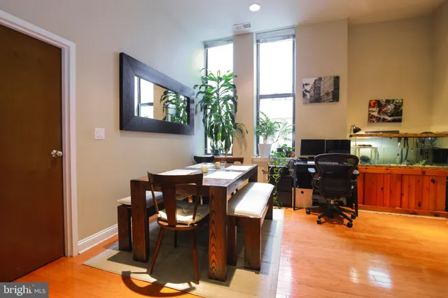 a workspace with furniture window and wooden floor
