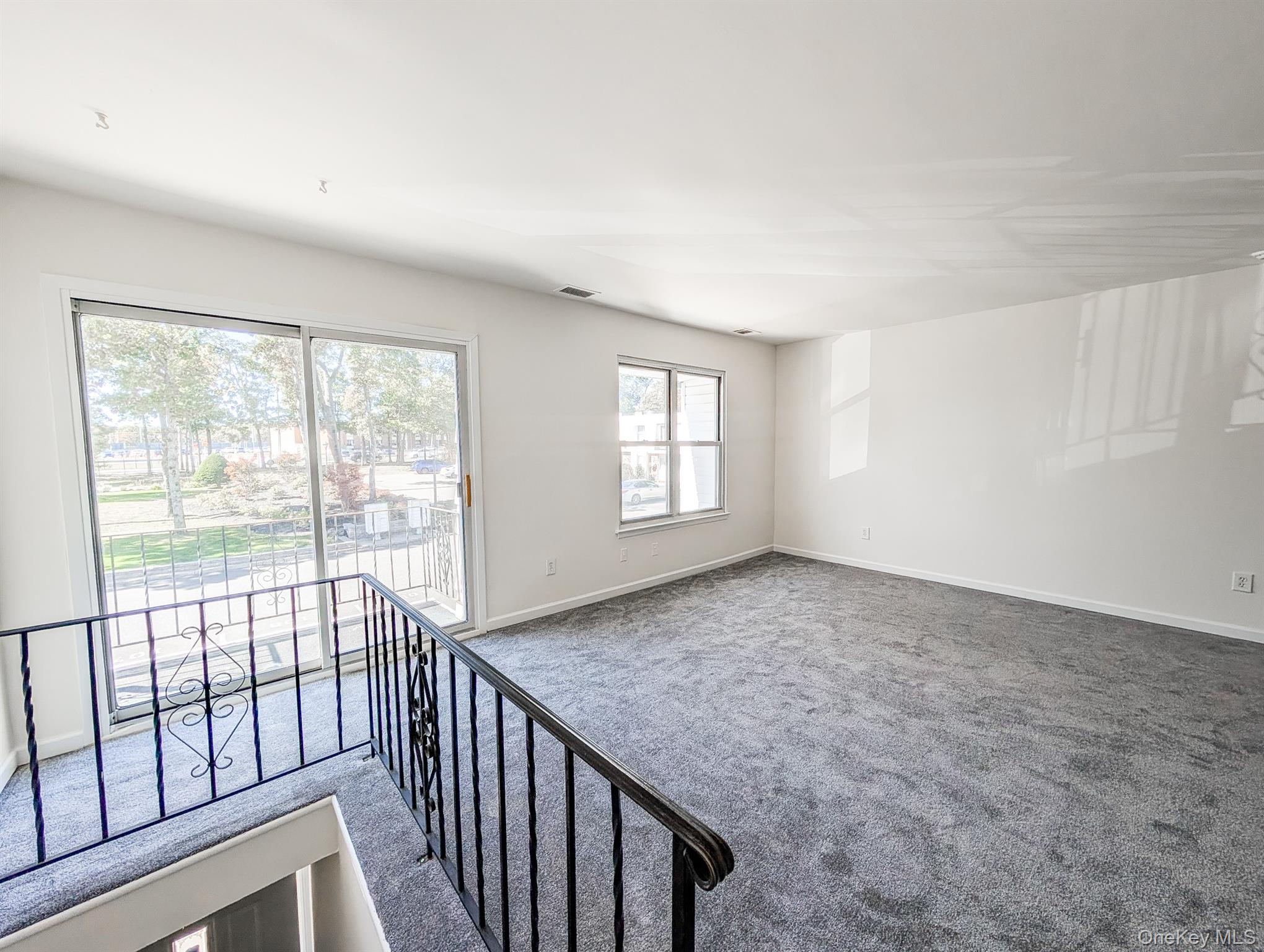 73 Rocky Point Yaphank Road, Unit 106 Rocky Point, NY 11778 - Photo 8 of 12 Unfurnished room with carpet and baseboards