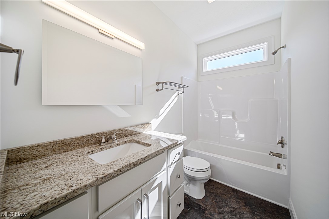 1745 Green Road Madison, OH 44057 - Photo 25 of 35 Full bathroom featuring tile flooring, shower / bathtub combination, toilet, and vanity