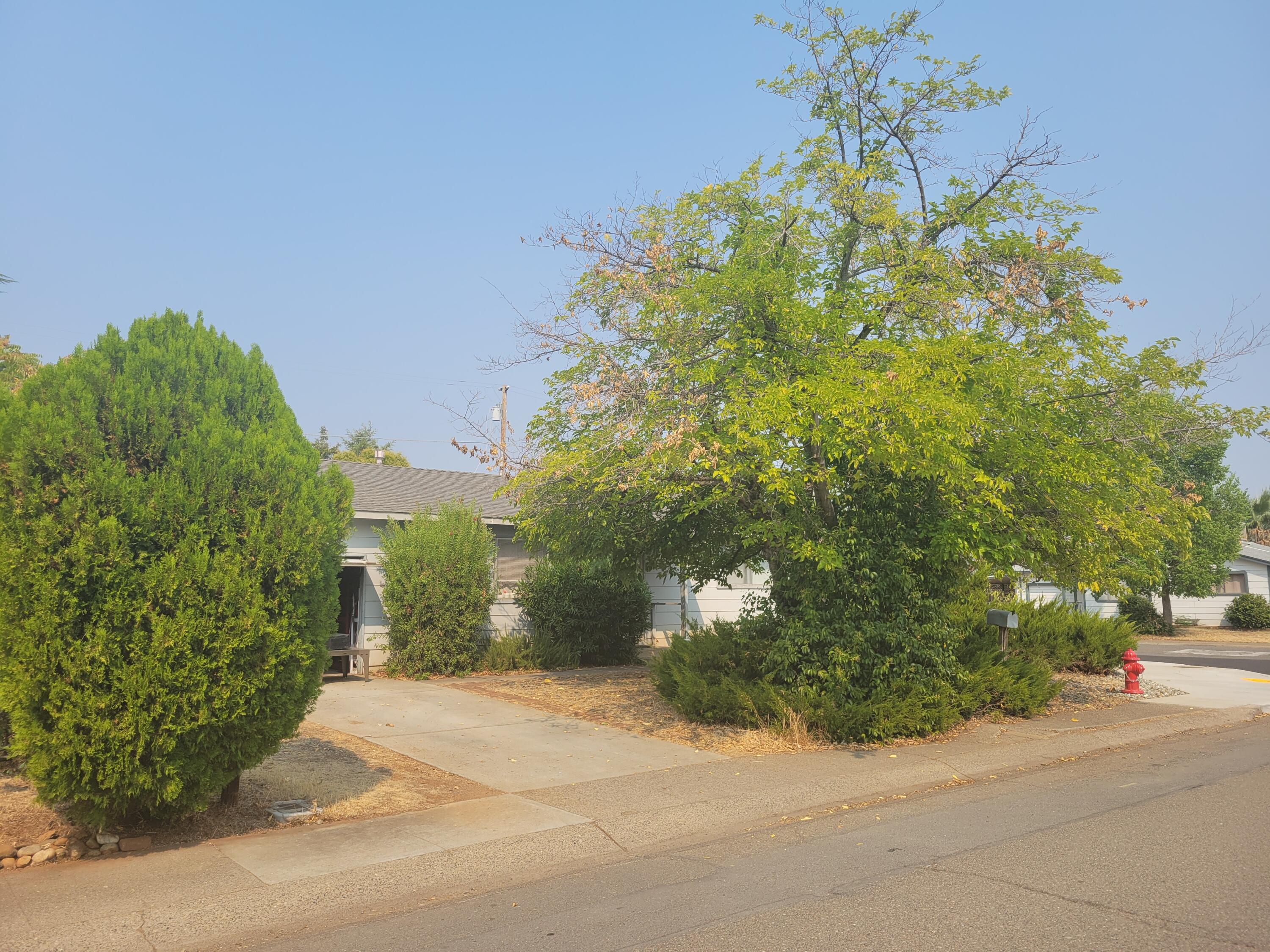 2490 Galaxy Way Redding, CA 96002 - Photo 1 of 30 a view of a garden with a pathway