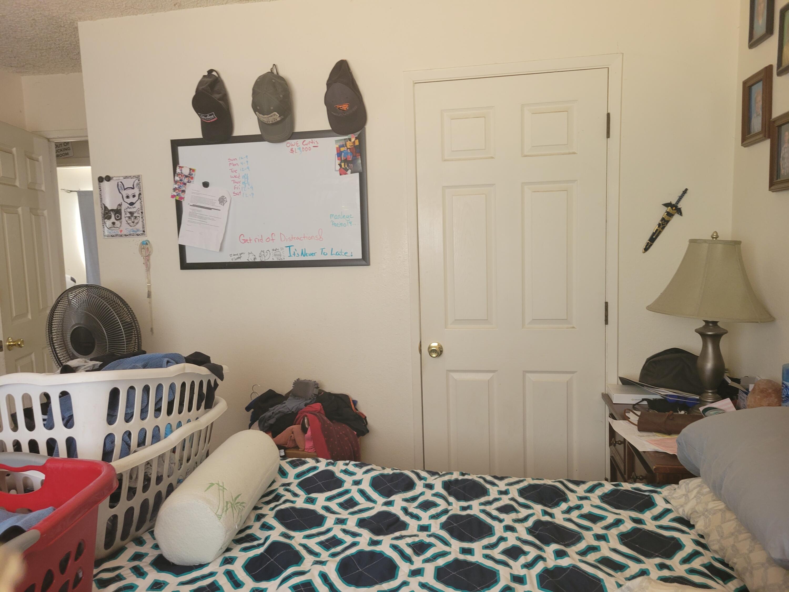 2490 Galaxy Way Redding, CA 96002 - Photo 13 of 30 a bedroom with a bed and wooden floor