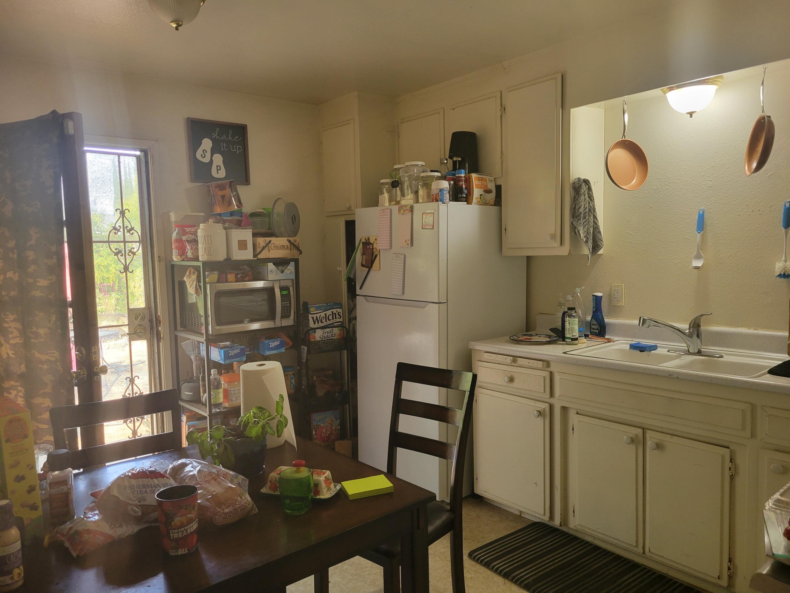 2490 Galaxy Way Redding, CA 96002 - Photo 19 of 30 a kitchen with refrigerator and window