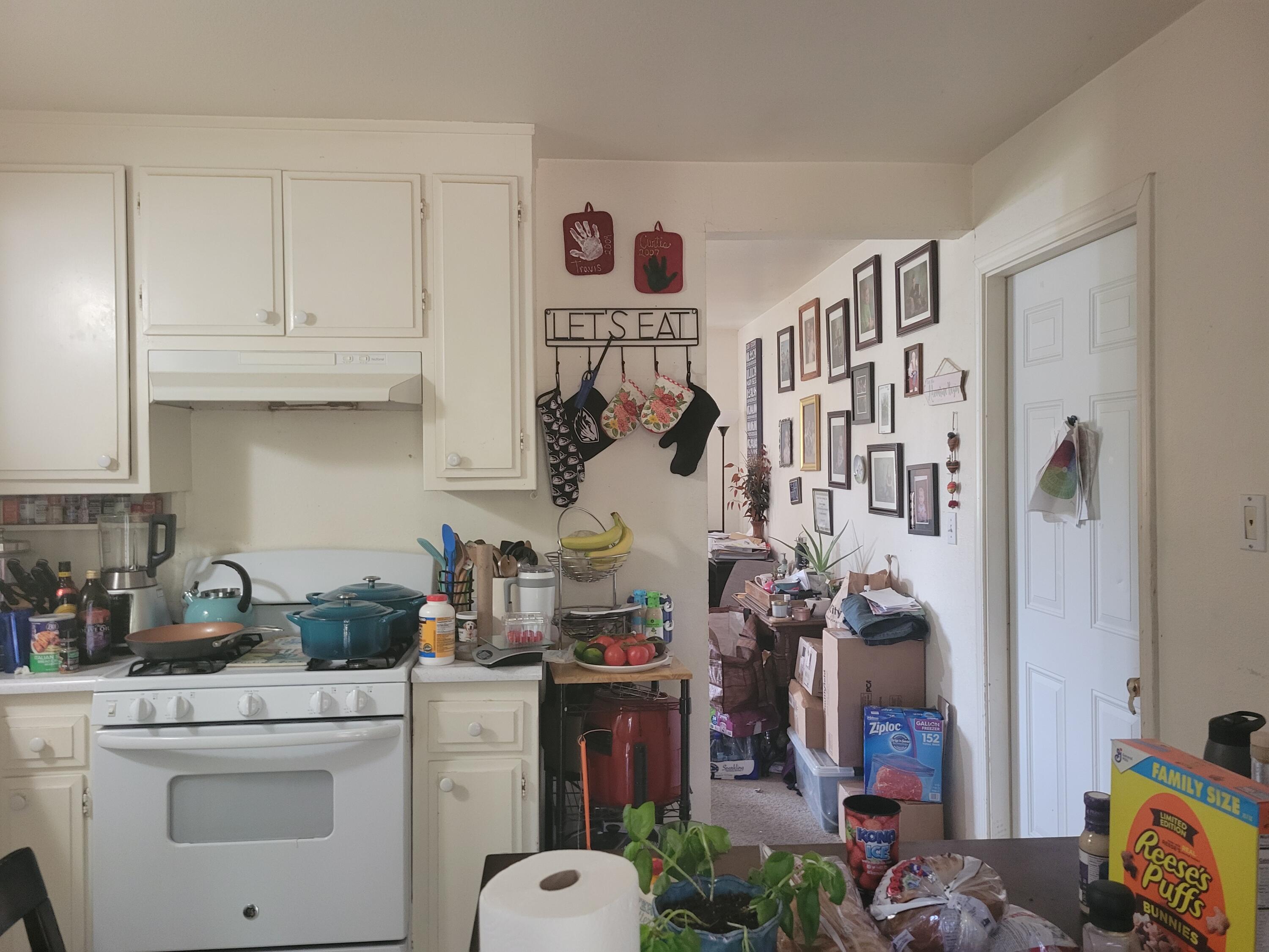 2490 Galaxy Way Redding, CA 96002 - Photo 20 of 30 a kitchen with white cabinets and appliances