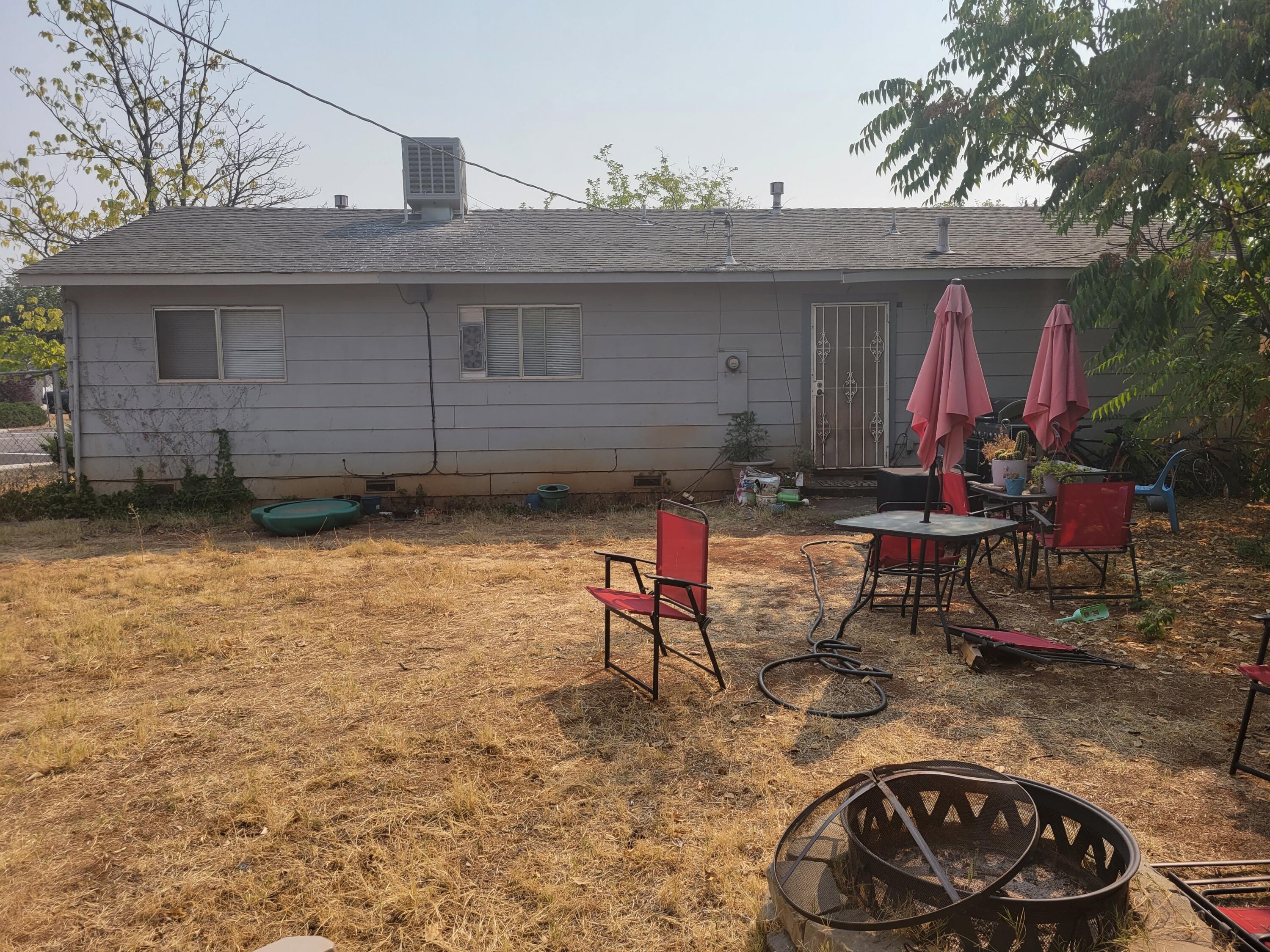 2490 Galaxy Way Redding, CA 96002 - Photo 24 of 30 a view of a chairs and fire pit in the patio
