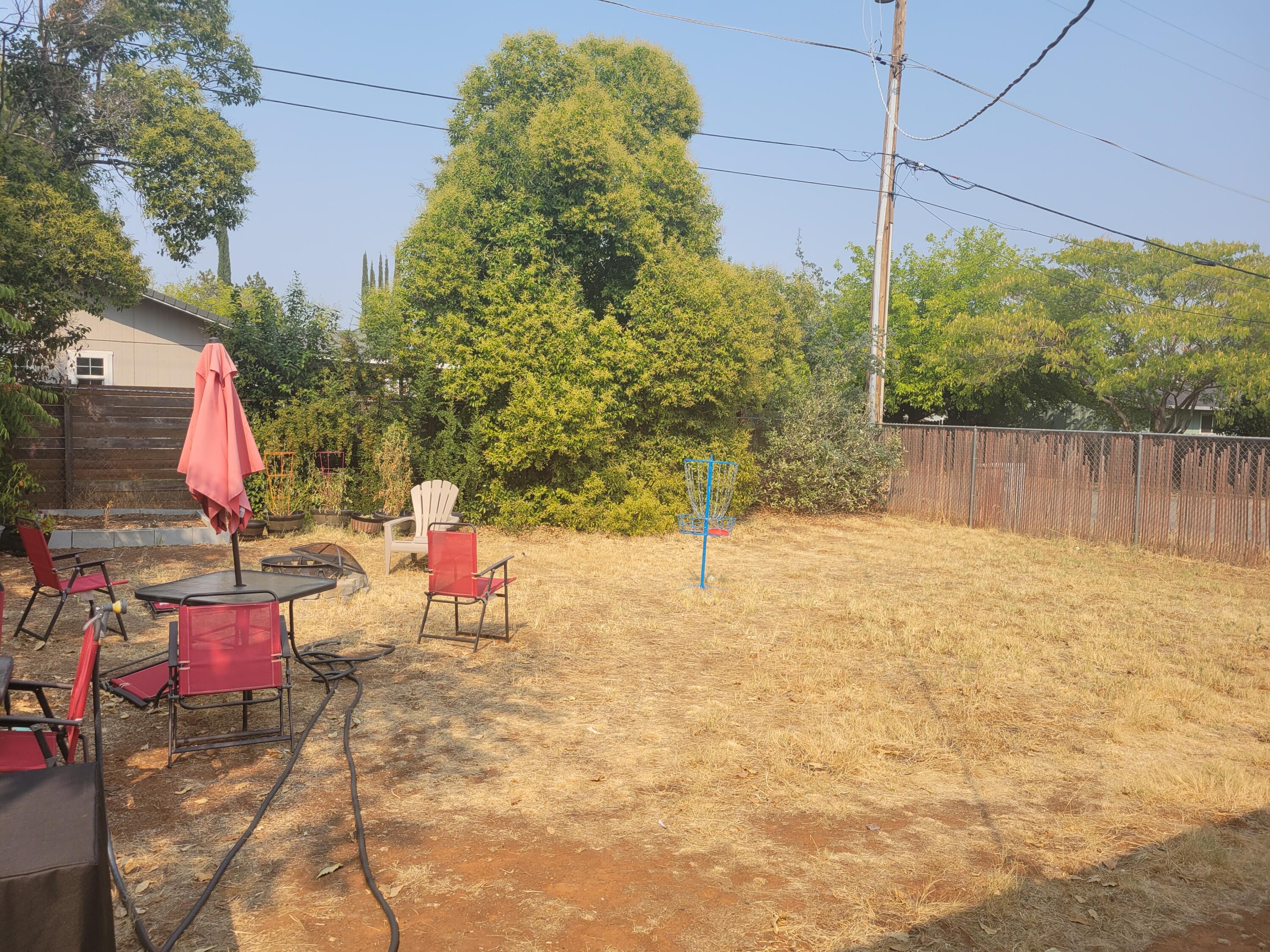 2490 Galaxy Way Redding, CA 96002 - Photo 26 of 30 a backyard of a house with seating space