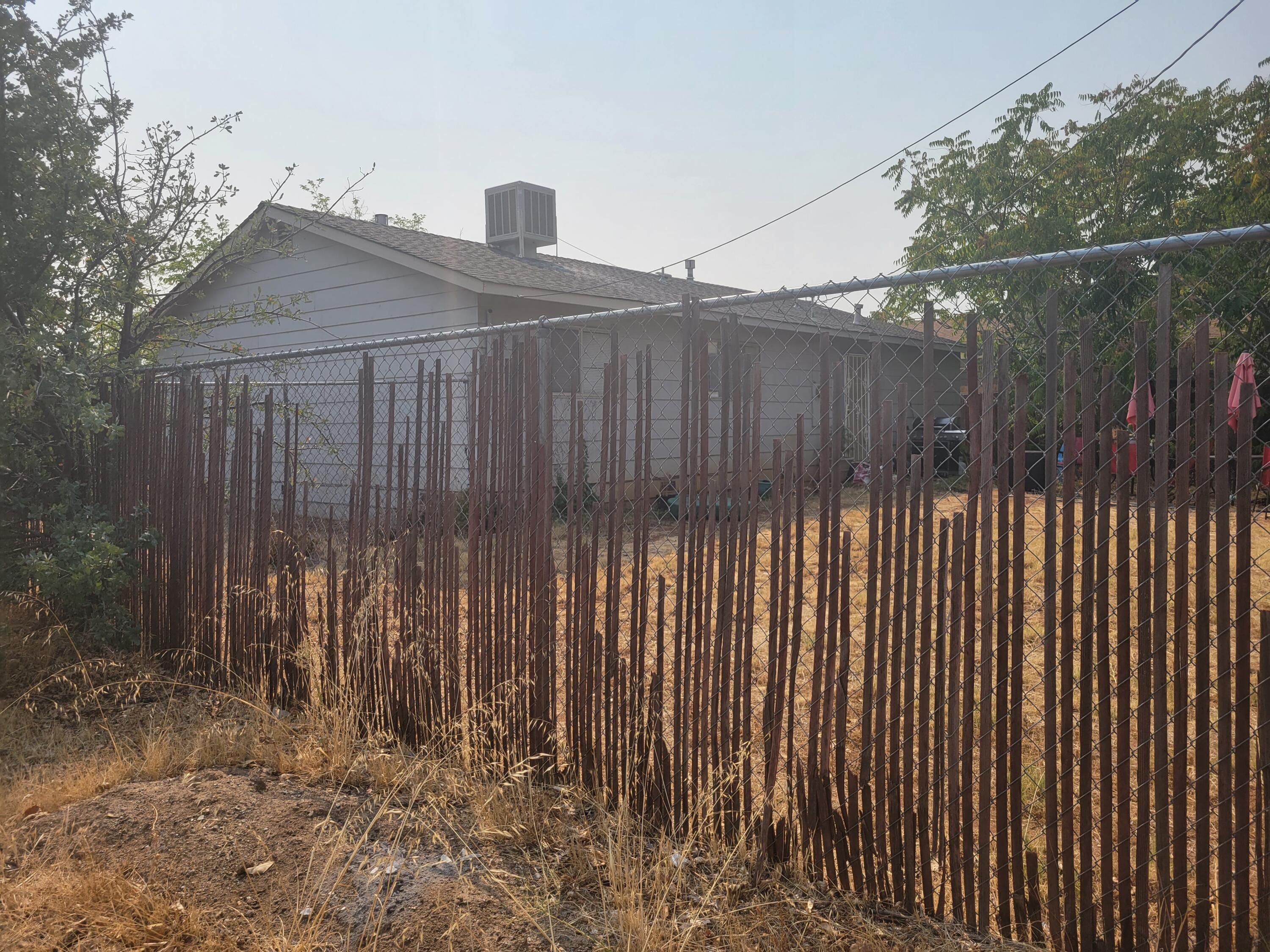 2490 Galaxy Way Redding, CA 96002 - Photo 28 of 30 a view of a house with a wooden fence