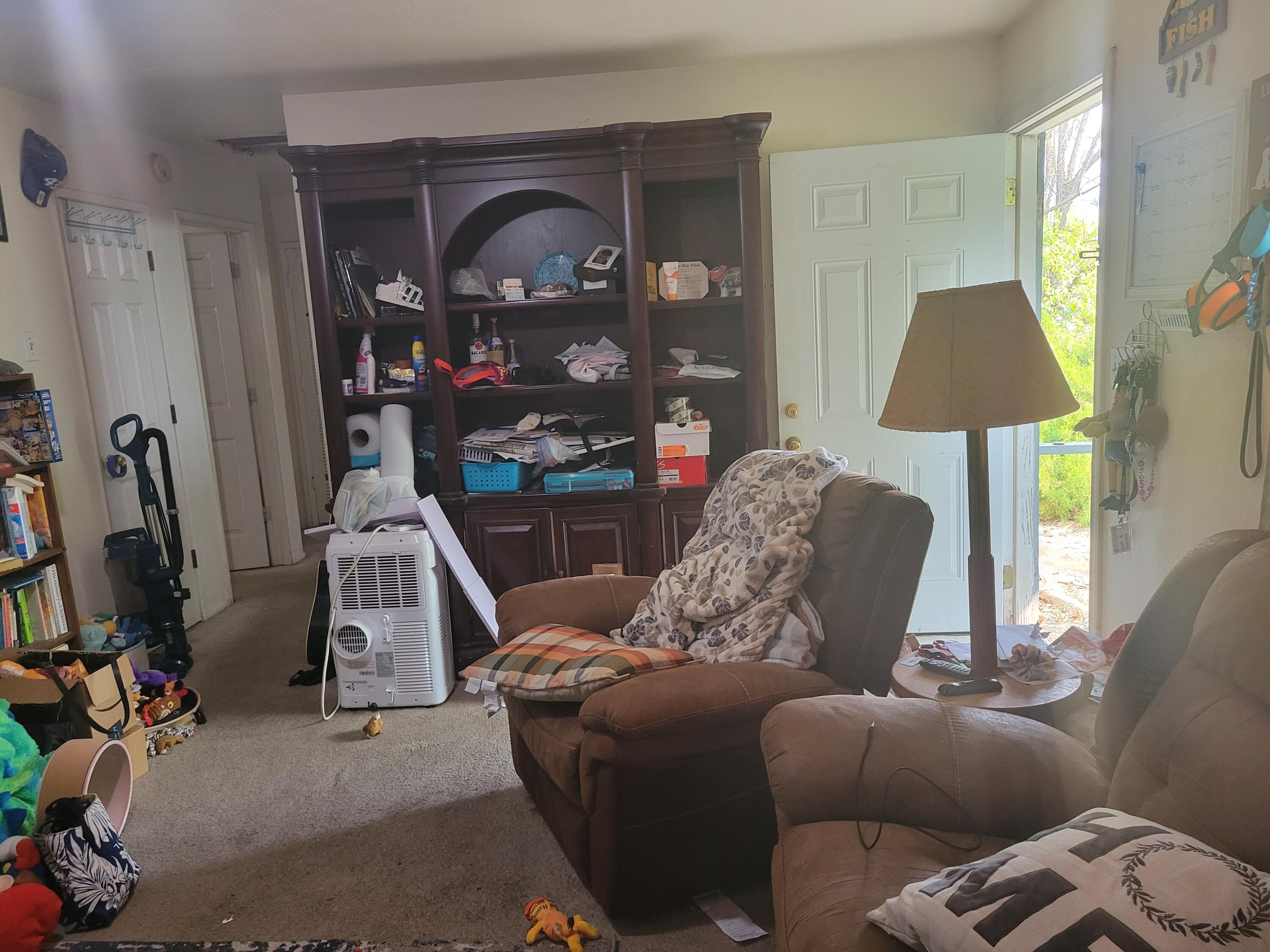 2490 Galaxy Way Redding, CA 96002 - Photo 5 of 30 a living room with furniture a flat screen tv and a window