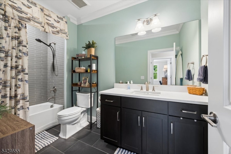 401 Mariners Pointe Hopatcong, NJ 07843 - Photo 26 of 42 a bathroom with a sink vanity mirror and toilet