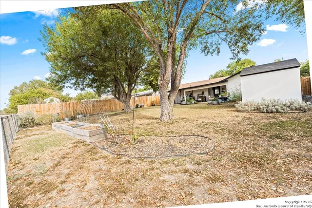 a view of a yard covered in snow