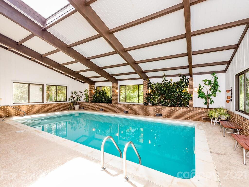 1032 Hooper Creek Road Tryon, NC 28782 - Photo 14 of 42 a view of a swimming pool with a patio
