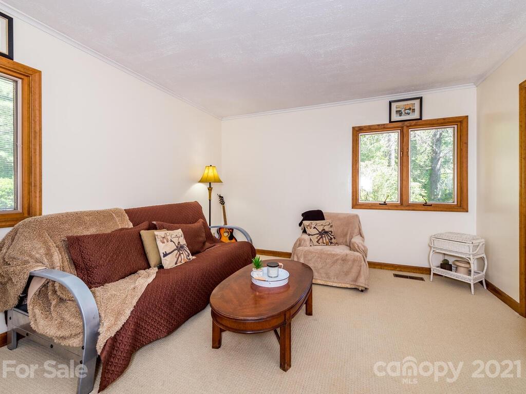 1032 Hooper Creek Road Tryon, NC 28782 - Photo 22 of 42 a living room with furniture and a window