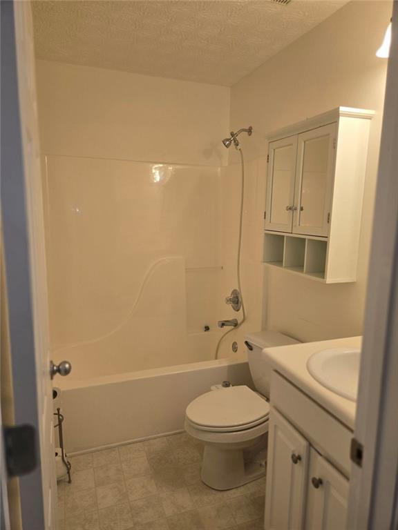 22 Windcrest Keep Covington, GA 30016 - Photo 30 of 32 a bathroom with a sink a toilet and shower
