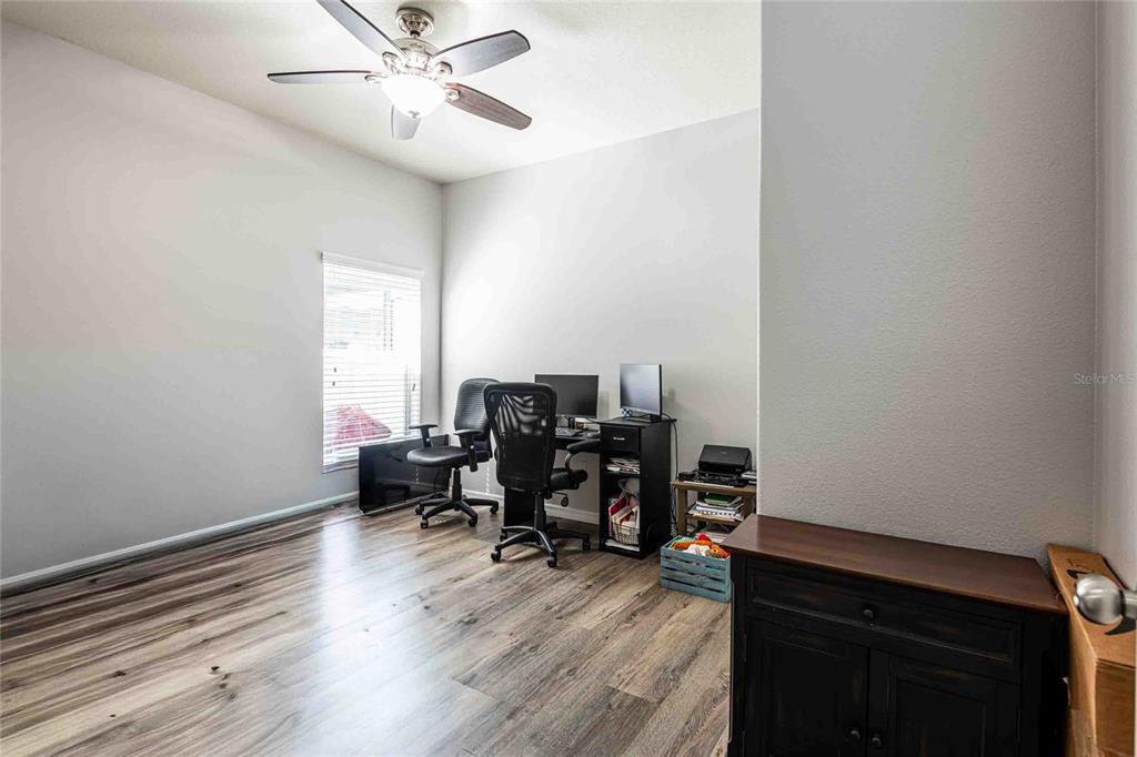 2814 Maple Brook Loop Lutz, FL 33558 - Photo 16 of 38 a view of a workspace with furniture and a window