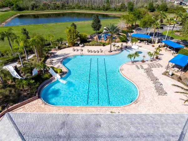 an aerial view of a house with a lake view and a mountain view