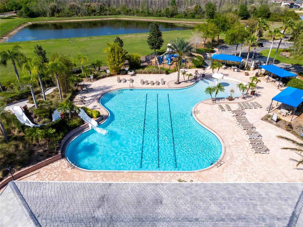 2814 Maple Brook Loop Lutz, FL 33558 - Photo 27 of 38 an aerial view of a house with outdoor space swimming pool and lake view