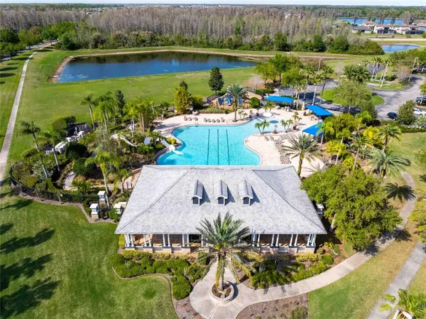 an outdoor space with pool and furniture