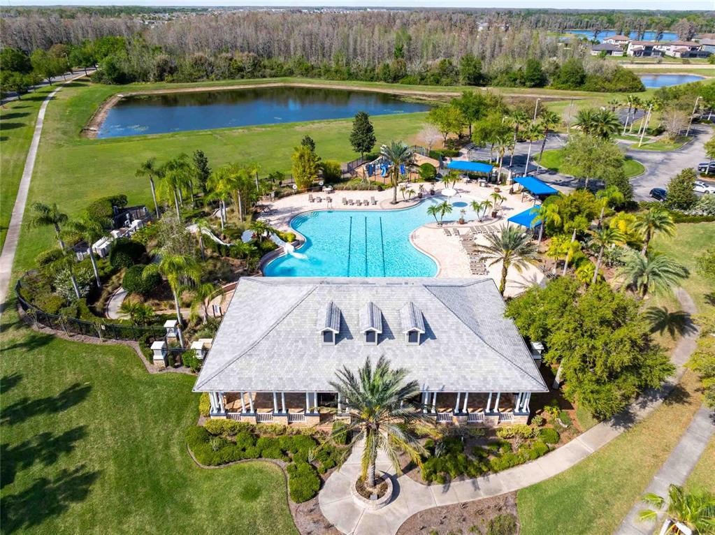 2814 Maple Brook Loop Lutz, FL 33558 - Photo 28 of 38 an aerial view of a house with a lake view and a mountain view