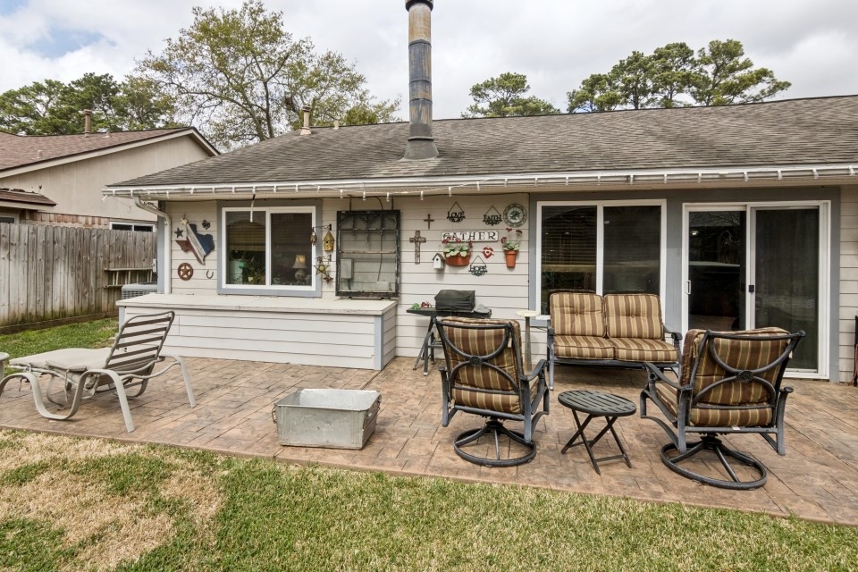 9211 Benwick Street Spring, TX 77379 - Photo 26 of 27 a patio with table and chairs