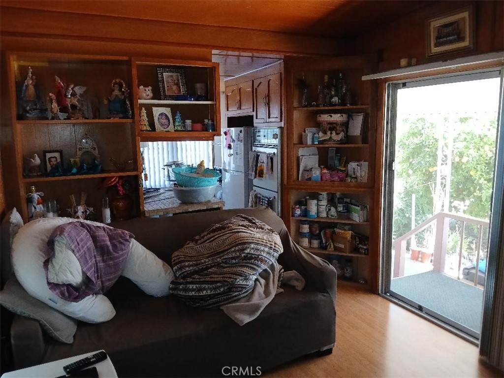 13645 5th Street, Unit 35 Yucaipa, CA 92399 - Photo 16 of 30 a living room with furniture a rug and a large window