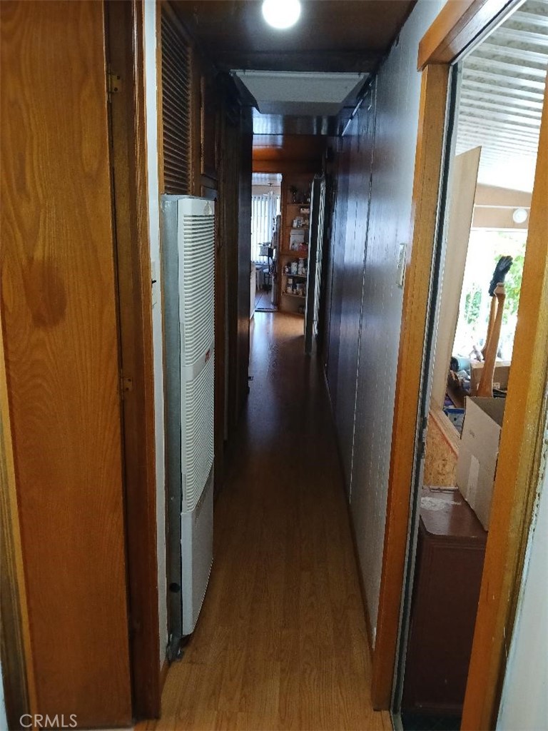 13645 5th Street, Unit 35 Yucaipa, CA 92399 - Photo 22 of 30 a view of a hallway with wooden floor