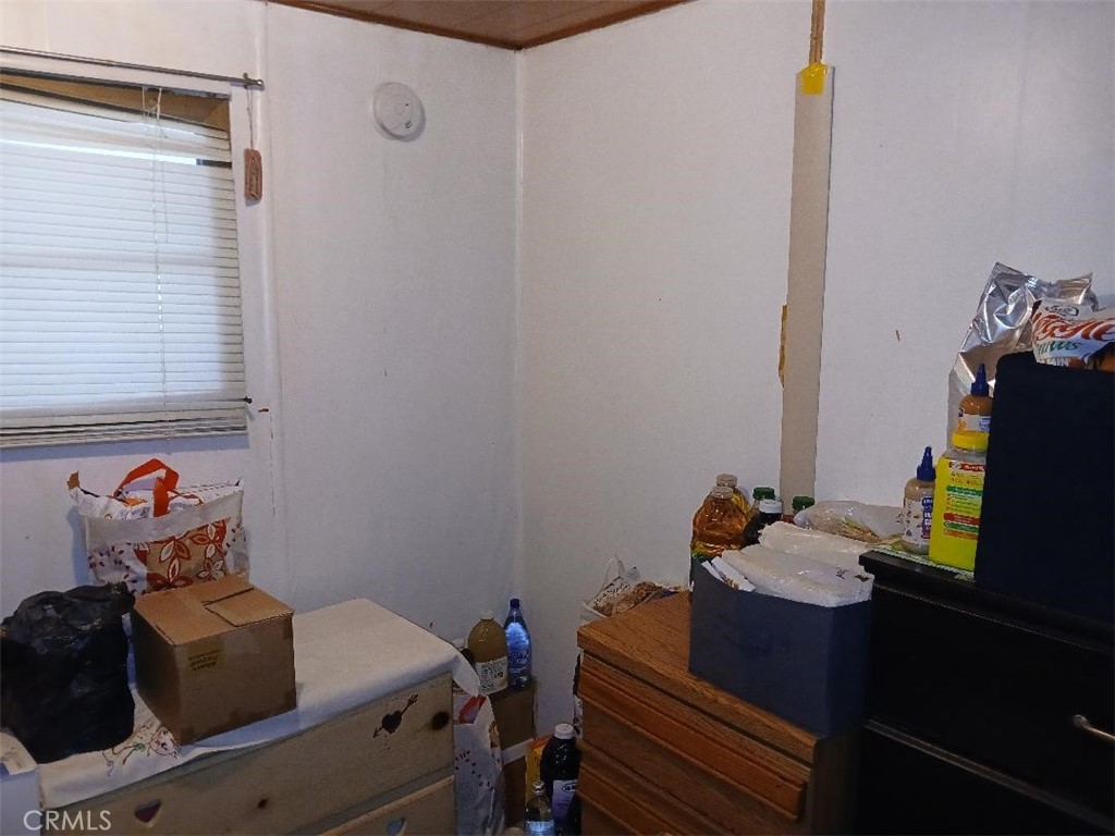 13645 5th Street, Unit 35 Yucaipa, CA 92399 - Photo 26 of 30 a room with furniture and a window
