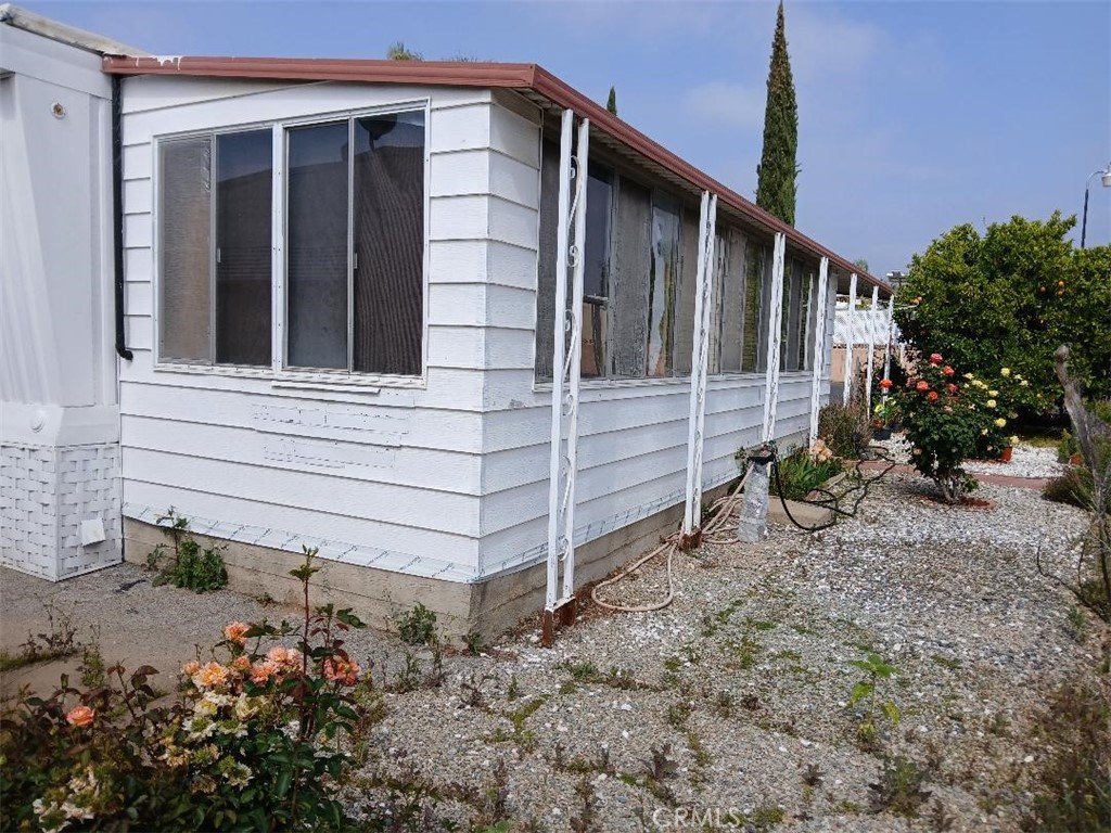 13645 5th Street, Unit 35 Yucaipa, CA 92399 - Photo 7 of 30 a view of house with backyard