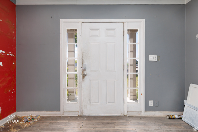 330 West 600th Street South Provo, UT 84601 - Photo 4 of 26 Entry door with sidelights and transoms, wood-finish flooring, and painted interior walls