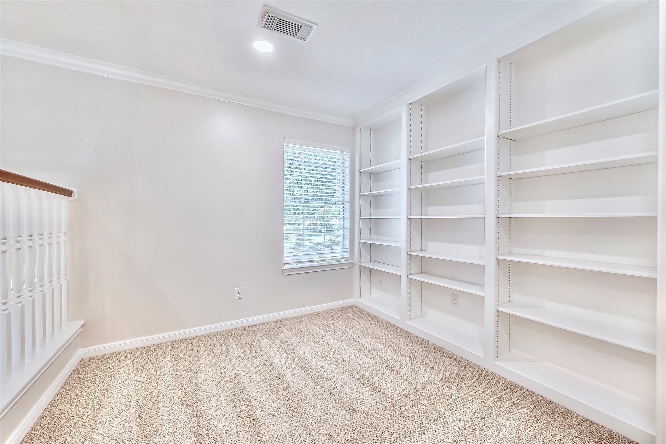 19 Calleston Court Sugar Land, TX 77479 - Photo 24 of 36 Built in shelves on the other side of the gameroom on the second floor, perfect for a small library