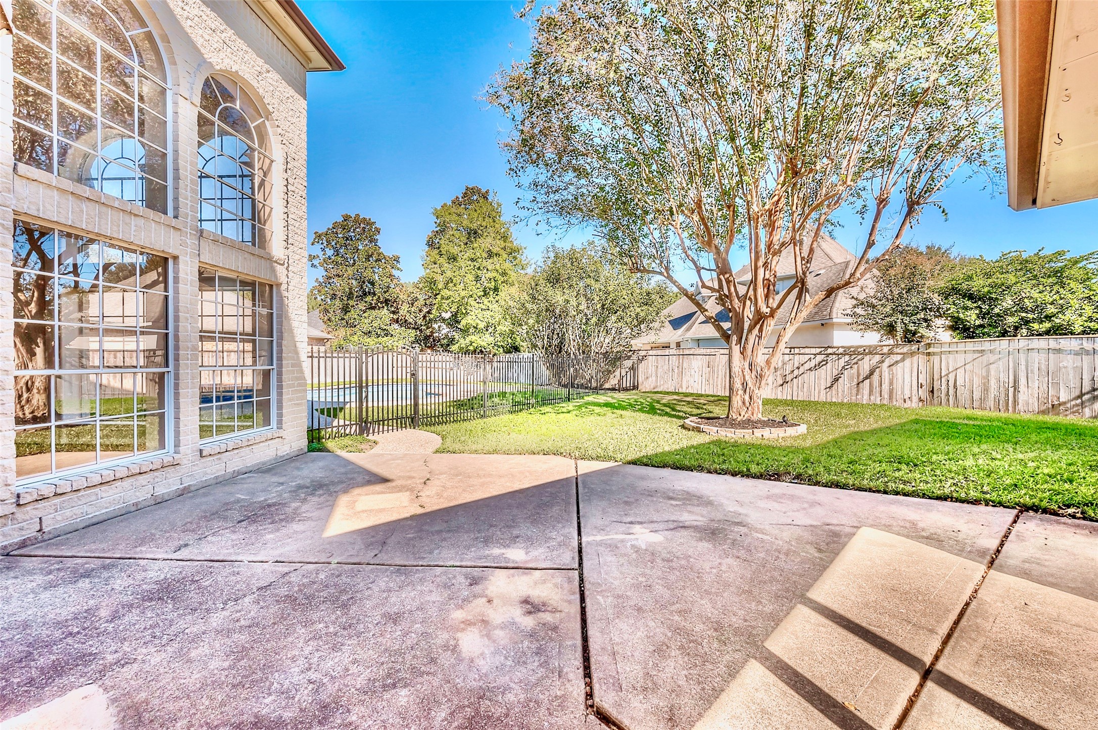 19 Calleston Court Sugar Land, TX 77479 - Photo 32 of 36 Patio area fenced off from the pool in the backyard