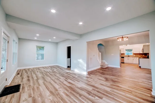 a bathroom with a bathtub and toilet