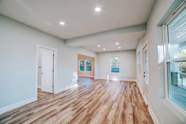 a bathroom with a double vanity sink and mirror with shower