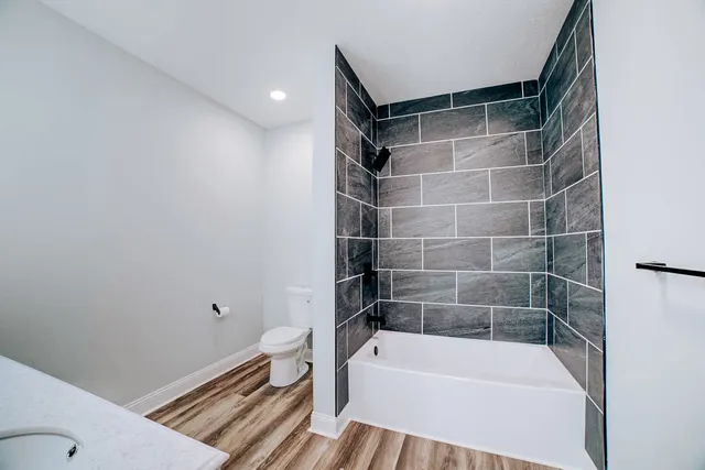 a view of a balcony with wooden floor