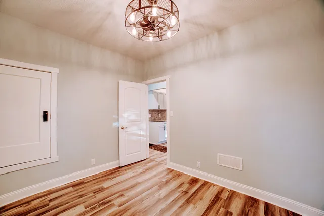 an empty room with a empty space and a window