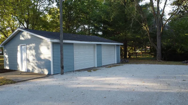 a kitchen with stainless steel appliances granite countertop a refrigerator a sink a stove and oven