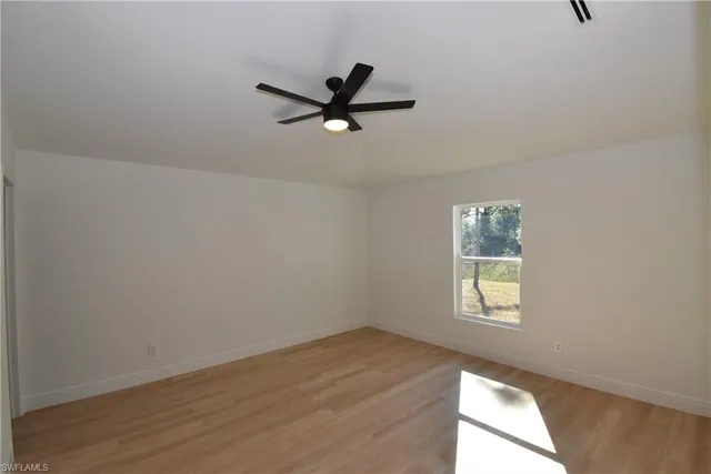 a view of an empty room and window