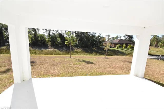 a view of a swimming pool with an outdoor seating