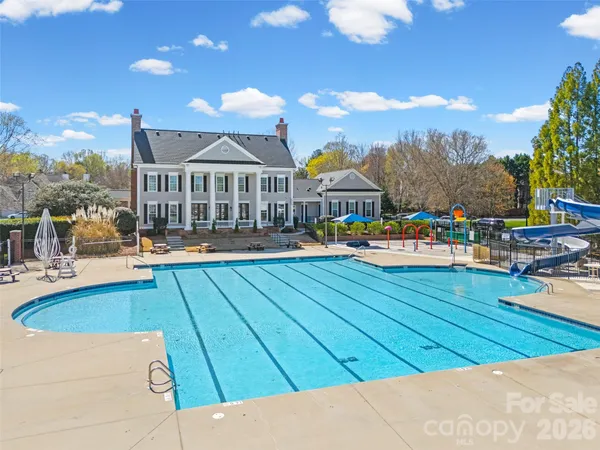 a view of swimming pool with outdoor seating
