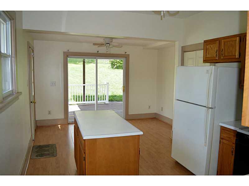 3129 Mount Morris Road Waynesburg, PA 15370 - Photo 4 of 19 Kitchen. Kitchen Island leads to a breakfast area and the sliding glass doors.