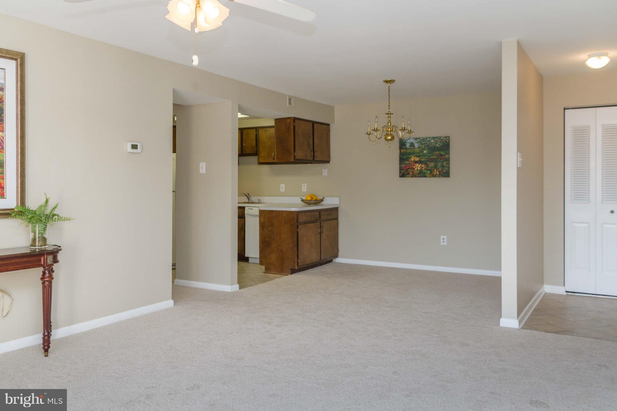 2572 Riva Road, Unit 20B Annapolis, MD 21401 - Photo 10 of 18 a view of a kitchen and a microwave a sink and cabinet