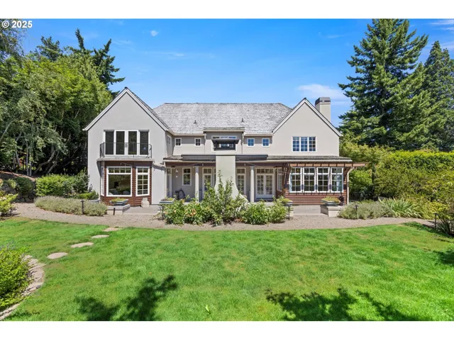a front view of a house with a yard table and chairs