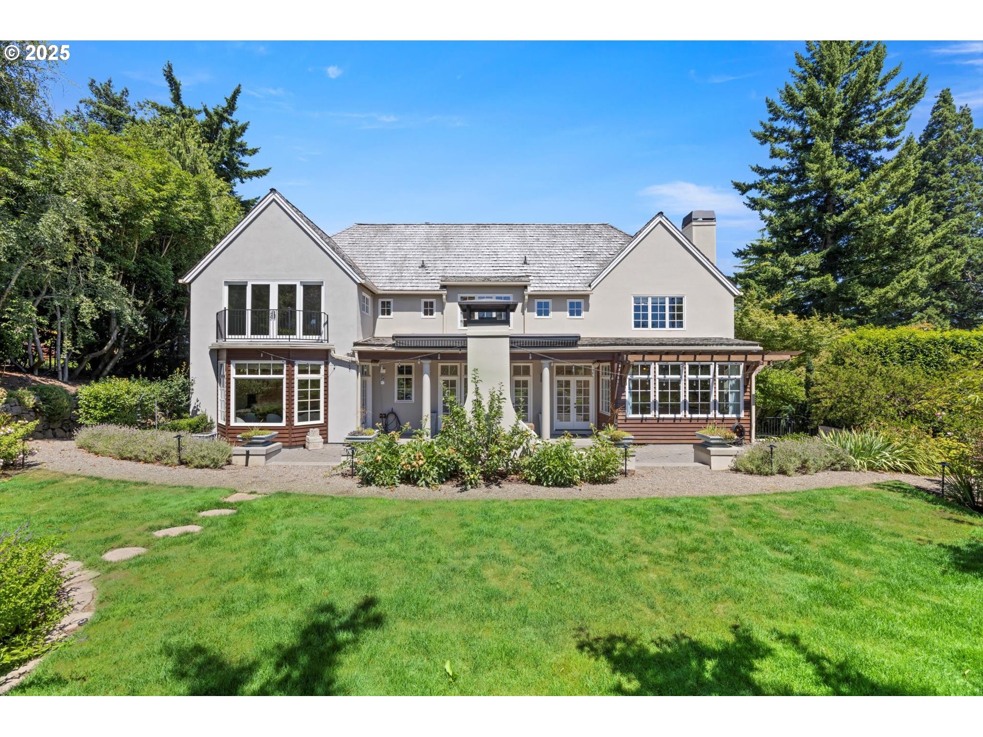 a front view of a house with a yard table and chairs