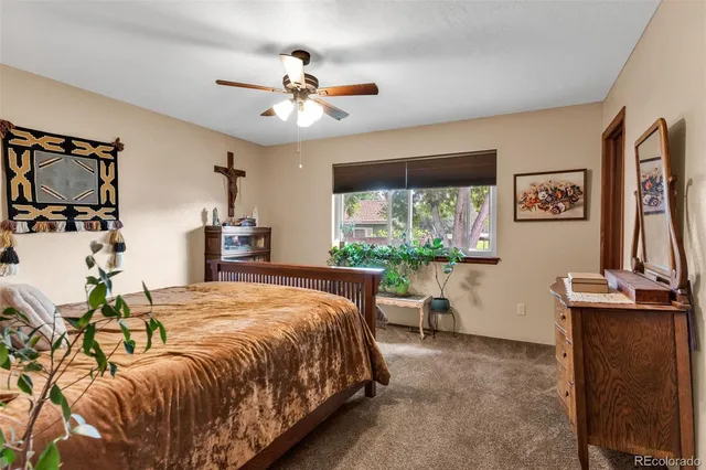 a bed room with a bed and a chandelier