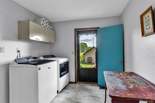 a kitchen that has a stove and a wooden floor