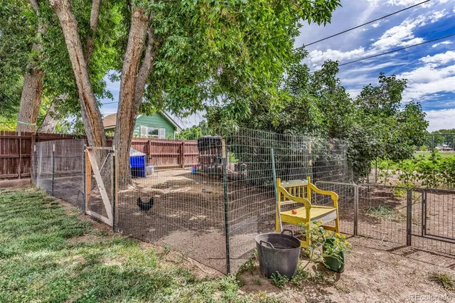 a view of a chair and table in the garden