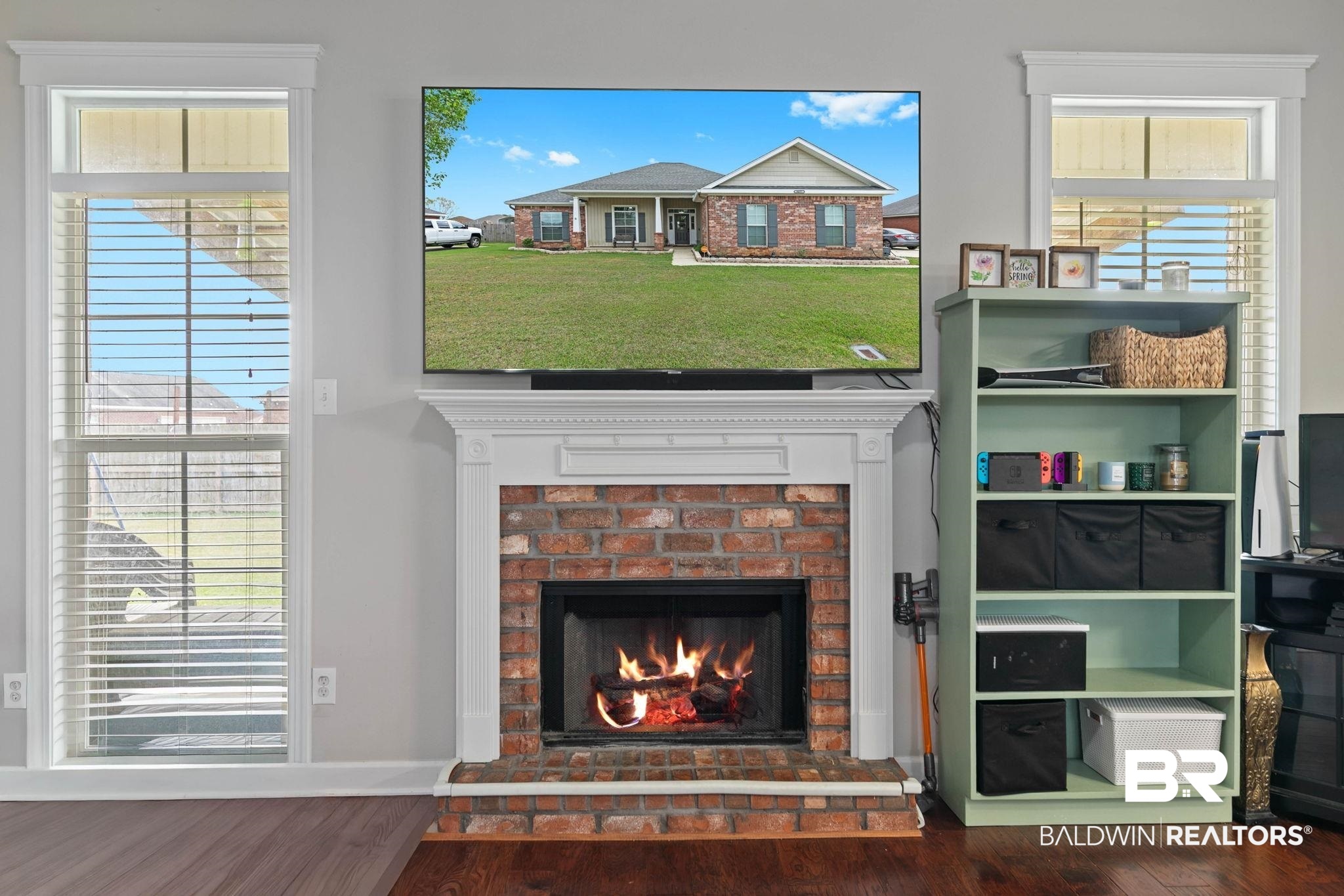9177 Labrador Trail Theodore, AL 36582 - Photo 6 of 24 Detailed view of a fireplace and wood finished floors