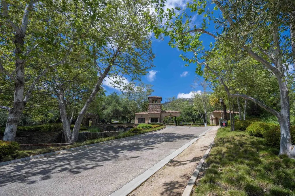 Cielo Rancho Santa Fe, CA 92067 - Photo 3 of 19 a view of a street with large trees