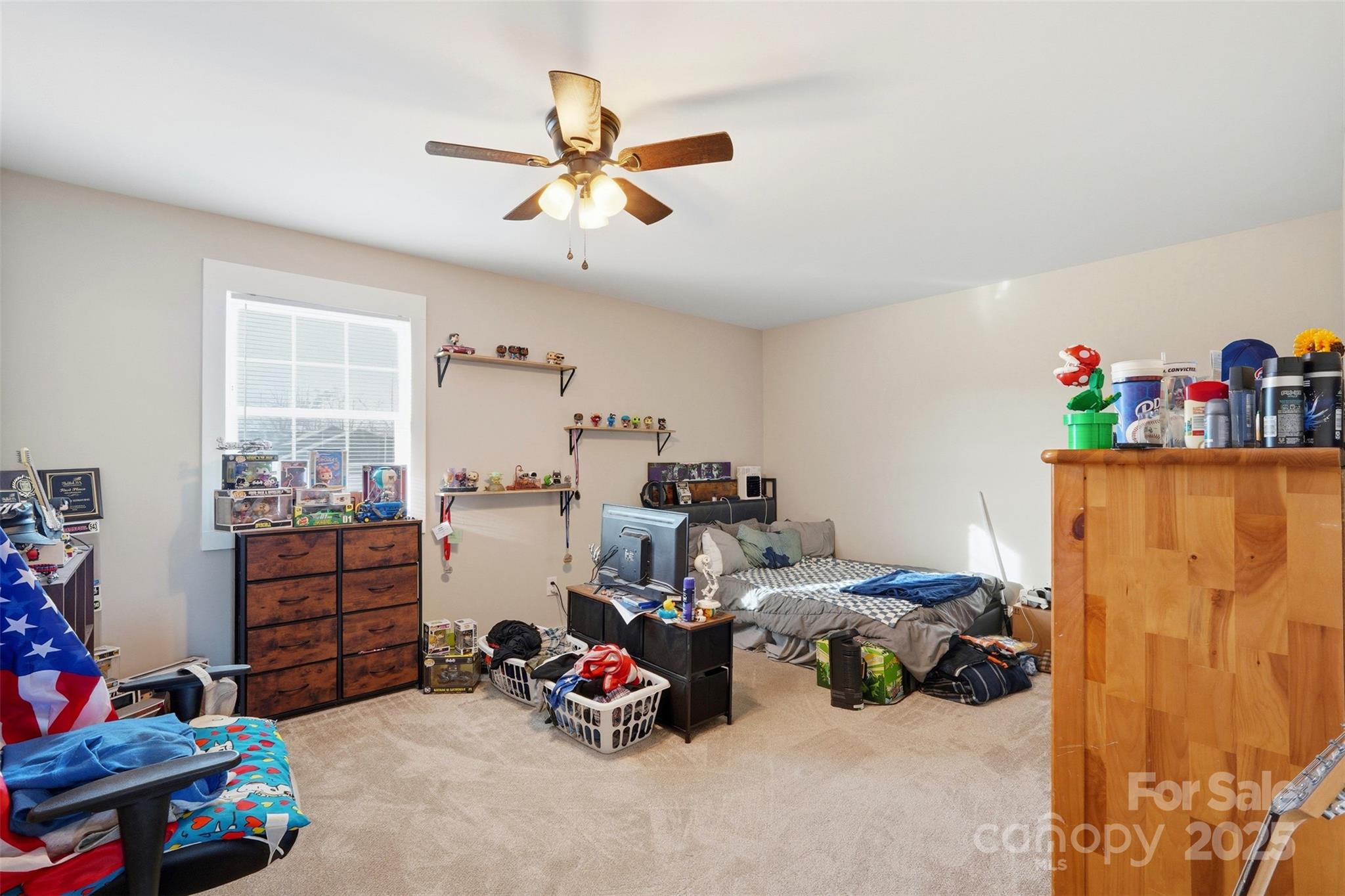 16659 Five Point Road Locust, NC 28097 - Photo 22 of 26 a bedroom with furniture and a window